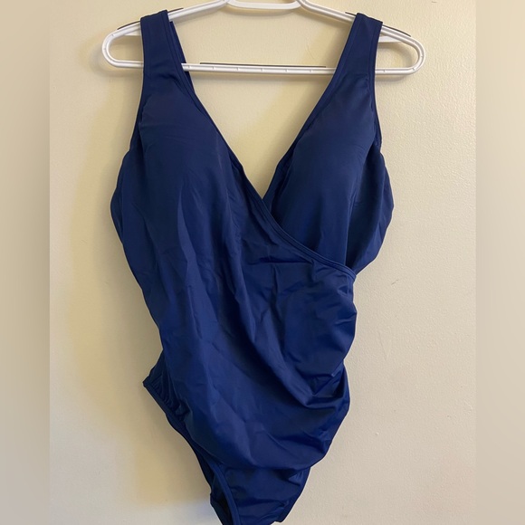 navy one piece bathing suit, never worn, soft padded cups. Faux wrap front - Picture 1 of 2